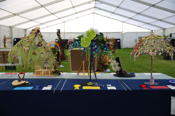 Flower Clubs of Cheshire  entries in the Singing in the Rain class of the 2025 Royal County Cheshire Show 